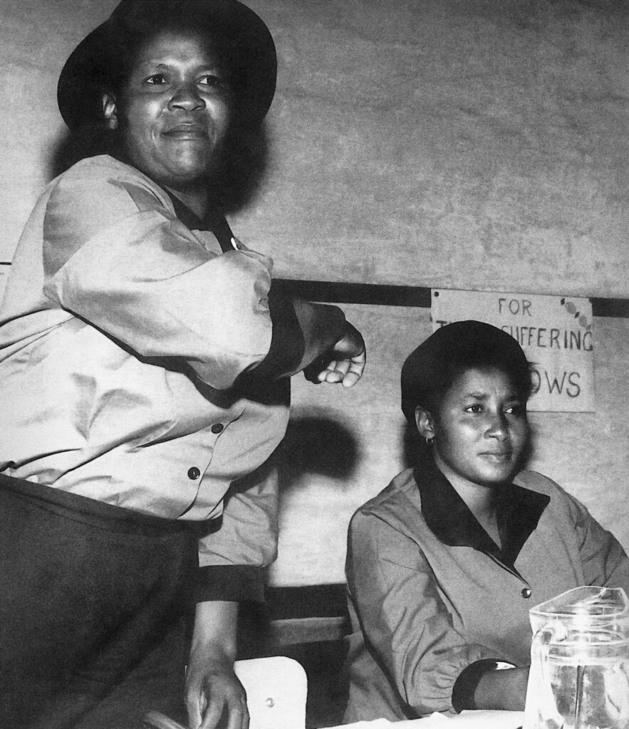 <p class="p1">An impassioned Albertina Sisulu addresses a meeting of women during the 1960s. She and her fellow activists referred to themselves as ‘The Suffering Widows’ because their husbands had been incarcerated for their political activities. During the struggle years, Sisulu was known for her tireless efforts to inspire other women. – <em>© Alf Kumalo Estate</em></p>
